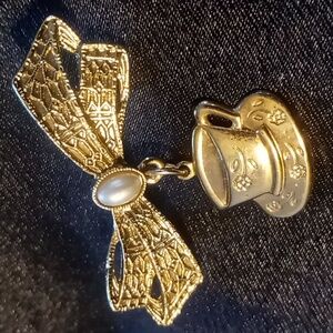 1928 lapel pin bow and teacup with faux pearl.